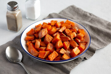 Homemade Roasted Sweet Potatoes on a Plate, side view.