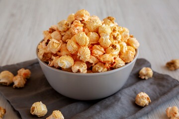 Homemade Crunchy Chicago-Style Popcorn with Caramel and Cheese in a Bowl, side view.