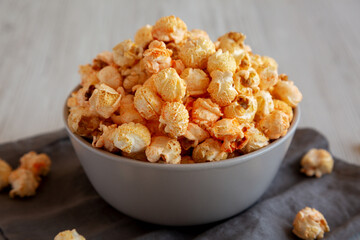 Homemade Crunchy Chicago-Style Popcorn with Caramel and Cheese in a Bowl, side view.