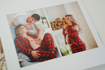 The pages of a photo book with color photos of a pregnant blonde and a man.