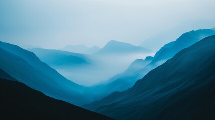 Fototapeta premium Serene minimalist mountain landscape with layered silhouettes and mist