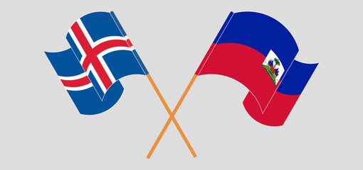 Crossed and waving flags of Iceland and Republic of Haiti. Vector illustration