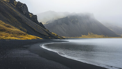 Misty Mountains and Black Sand Beach in Serene Coastal Landscape