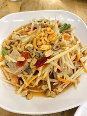 Thai papaya salad, grilled chicken papaya salad, a famous Thai food.