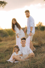 Fototapeta premium Parents, kids and happy family in park, garden and sunshine field outdoors for bonding, love and quality time together. Mom, dad and girl child of black family having fun, relax and care in nature