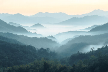 Misty mountain range with soft blue tones in the morning light
