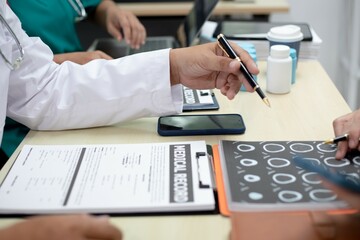 Fototapeta premium Businessman shaking hands with doctor in conference room Doctor and pharmacist shaking hands in medical office Salesman with new medicines shaking hands in hospital with medical team