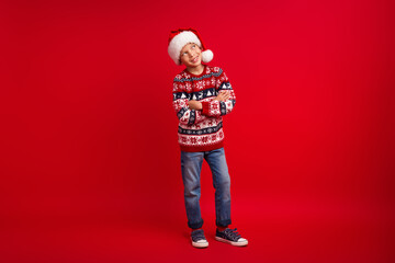Full body photo of cute little boy folded hands look empty space celebrate christmas wear knitwear...