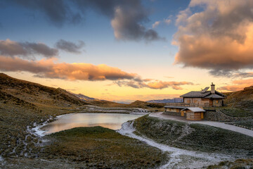 Passo Rolle with lake and Baita Segantini hut