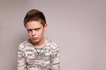 portrait of a boy with an offended expression