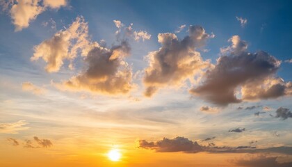 Fototapeta premium sunset sky clouds vertical in the evening on summer season with orange yellow sunlight on blue sky background