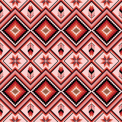 Vibrant pixel art pattern combines geometric shapes and nature-inspired elements, featuring diamonds and feathers in warm reds, blacks and pinks. Perfect for textiles, fashion and digital design