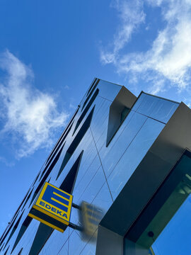 Edeka Supermarket logo on modern building in Berlin, Germany