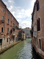 Canal and old buildings in Venice, Italy.