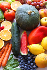 Various seasonal fruits and vegetables on white background. Summer and fall produce. Selective focus.