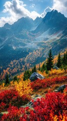 Stunning autumn landscape showcasing vibrant red and orange foliage against majestic mountains and a clear blue sky.