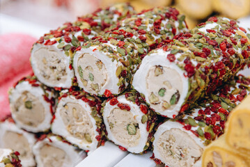white Turkish delight lokum with seeds, Turkish sweets for sale on street
