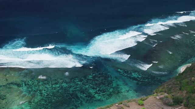 Ocean with waves and largest rip current. Drone view of scenic seascape in Bali