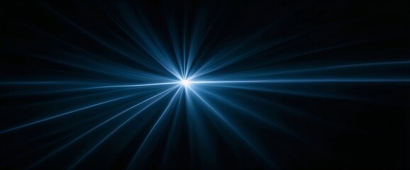 A bright blue light is shining on a dark background. The light is very bright and is the center of attention