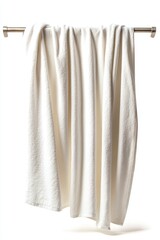 A soft white towel elegantly draped on a silver rack, exuding tranquility.