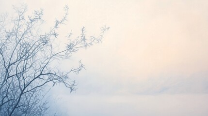 Fototapeta premium A solitary branch stretches toward a pale sky, capturing the essence of a tranquil winter morning in nature