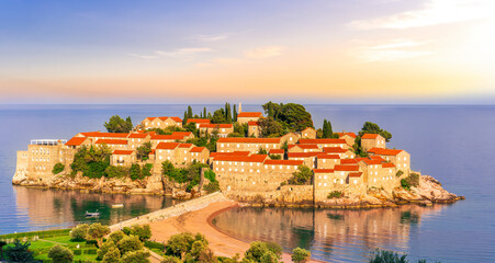 panoramic landscape of sea island sunrise or sunset with beautiful orange roofs and buildings, sea...