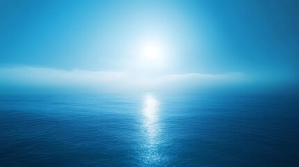 Obraz premium A serene blue gradient envelops the horizon at dawn, reflecting tranquility over calm waters background