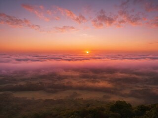 Obraz premium A peaceful early morning sky at dawn with low-hanging, fluffy clouds in soft shades of pink and orange, the sun just starting to peek over the horizon 