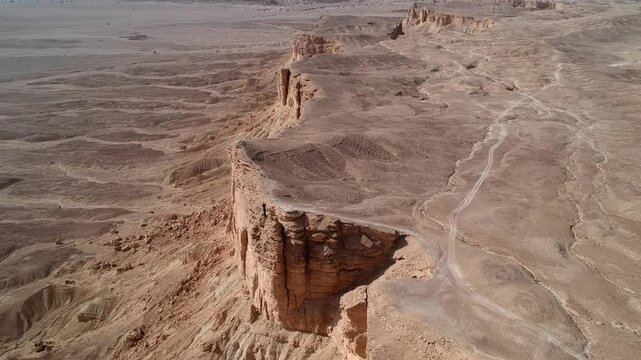 Camera drone ascends above Edge of the World, a popular tourist destination near Riyadh