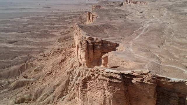 Camera drone flies ahead over Edge of the World, a popular tourist destination near Riyadh