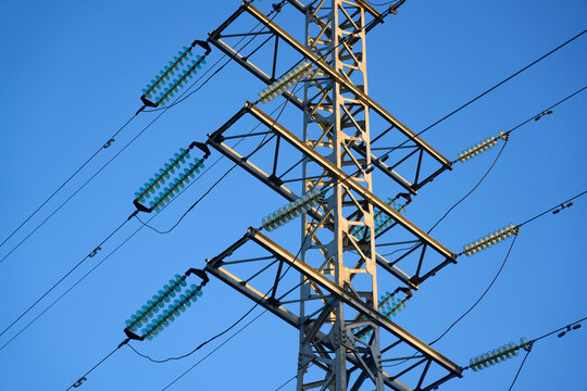 High voltage towers aganist the blue sky background. High quality photo