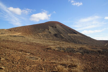 desertic landscape of volcano and caldera on the sea side
