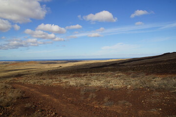 desertic landscape of volcano and caldera on the sea side