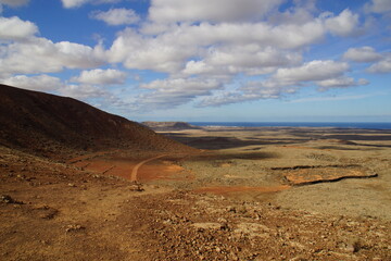 desertic landscape of volcano and caldera on the sea side