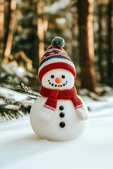 Cute snowman in a hat and scarf against the backdrop of a snowy landscape.  Welcome Christmas card with copy space.  Winter children's activities