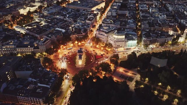 Madrid in the evening drone view, downtown Madrid with night lights, Puerta de Alcala crossroads in Madrid aerial view, capital of Spain at night