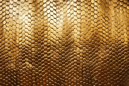 texture of gold shiny snakeskin leather empty background