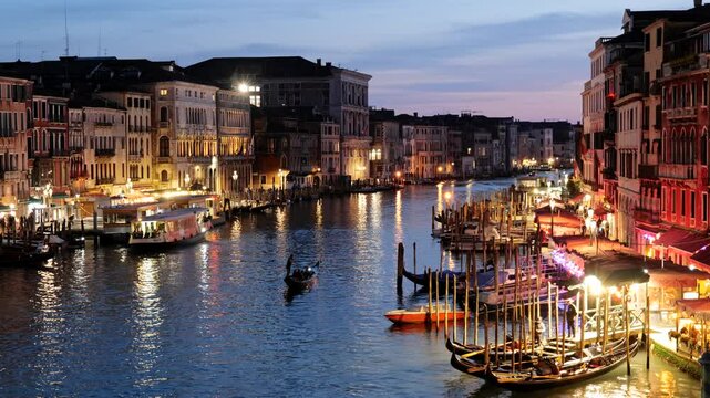 Evening in city of Venice in Italy. The Grand Canal between San Marco and San Polo districts as seen from the Rialto Bridge.