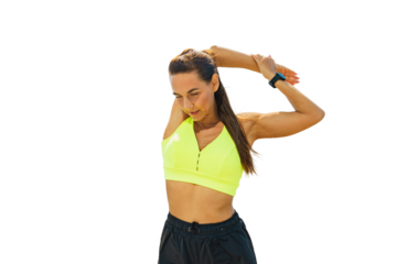 A Woman Stretches Her Arms in a Bright Yellow Sports Top During a Sunny Outdoor Workout Session