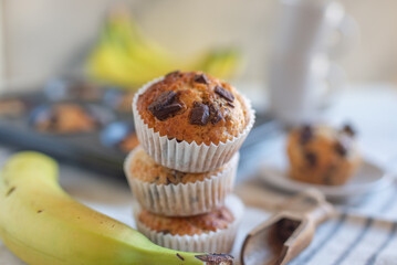 Banana chocolate chip muffins on a baking rack