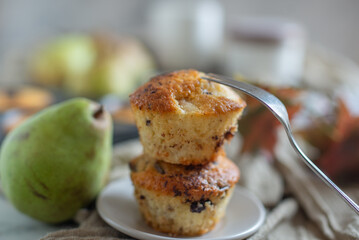 Banana chocolate chip muffins on a baking rack