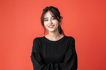 Smiling brightly in a yellow attire, a young woman radiates confidence and cheerfulness, showcasing a stylish and lively spirit.