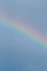 rainbow in a sky against rain cloud