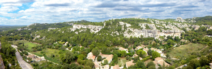 Fototapeta premium Panoramic view of the nature and exceptional landscapes of the Alpilles from the village of Baux de Provence, made famous by its castle and the many artists who visited it : Cezanne, Van Gogh...