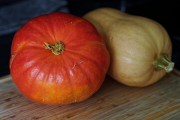 Pumpkin and squash on a cutting board. Selective focus.