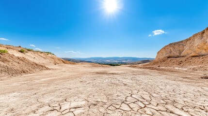 Dry Landscape Under Bright Blue Sky and Sunlight
