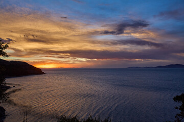 stunning sunset over Suasi Island. The sky transforms into a canvas of colors, reflecting the beauty and serenity of this magical place. Titicaca Lake Peru