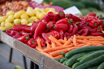 Fresh vegetables displayed on a farmer's market counter