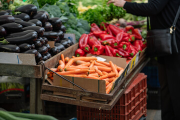 Fresh vegetables displayed on a farmer's market counter