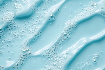Close-up view of soap bubbles on a blue surface